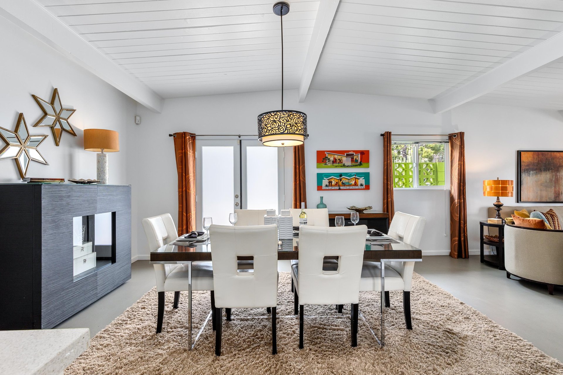 Indoor dining table with white chairs