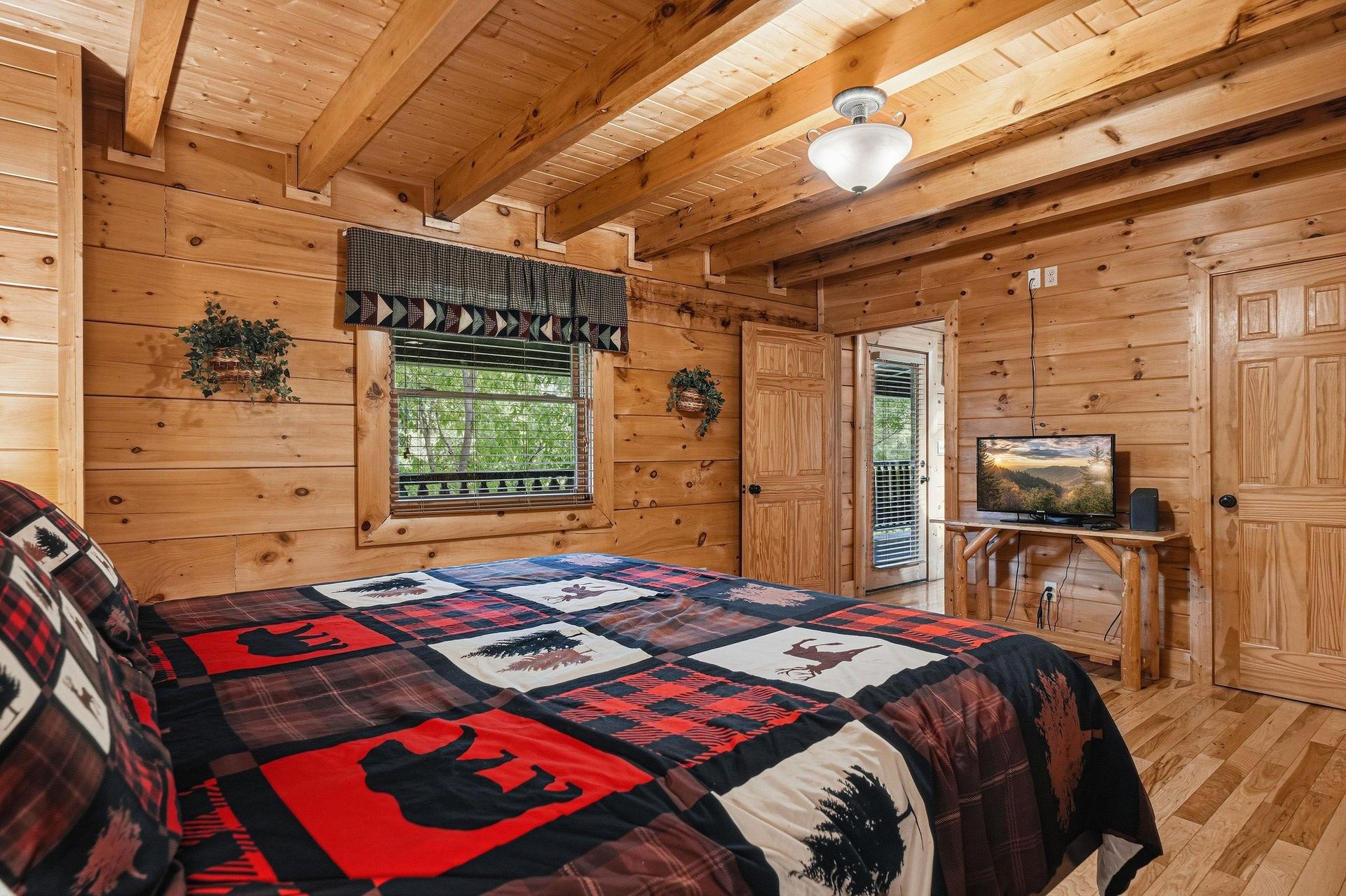 Cozy log cabin bedroom with rustic charm, warm wood beams, and naturethemed quilted bedding for peaceful mountain retreat nights.