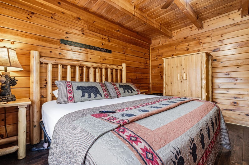 Sink into rustic luxury in your cozy log bedroom, where handcrafted wooden beams frame your restful retreat perfectly.