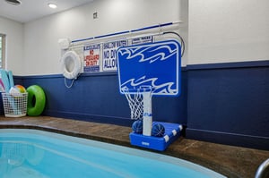 Your private indoor pool features poolside basketball, colorful toys, and lifesaving equipment—perfect for splashing around safely with family and friends.
