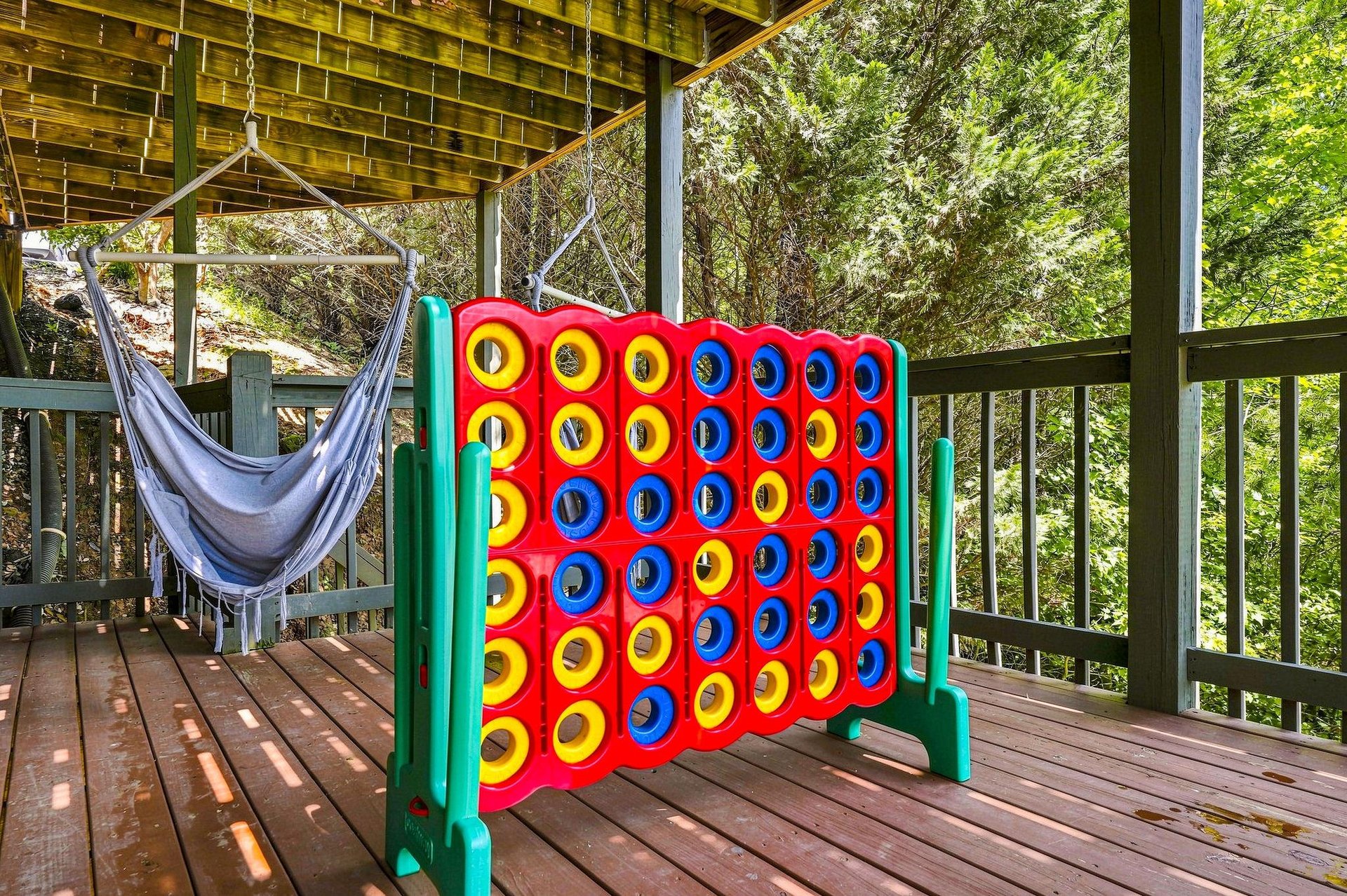 Unwind in your hammock or challenge family to a game on this private deck nestled among the trees.