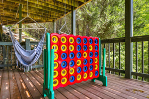 Unwind in your hammock or challenge family to a game on this private deck nestled among the trees.