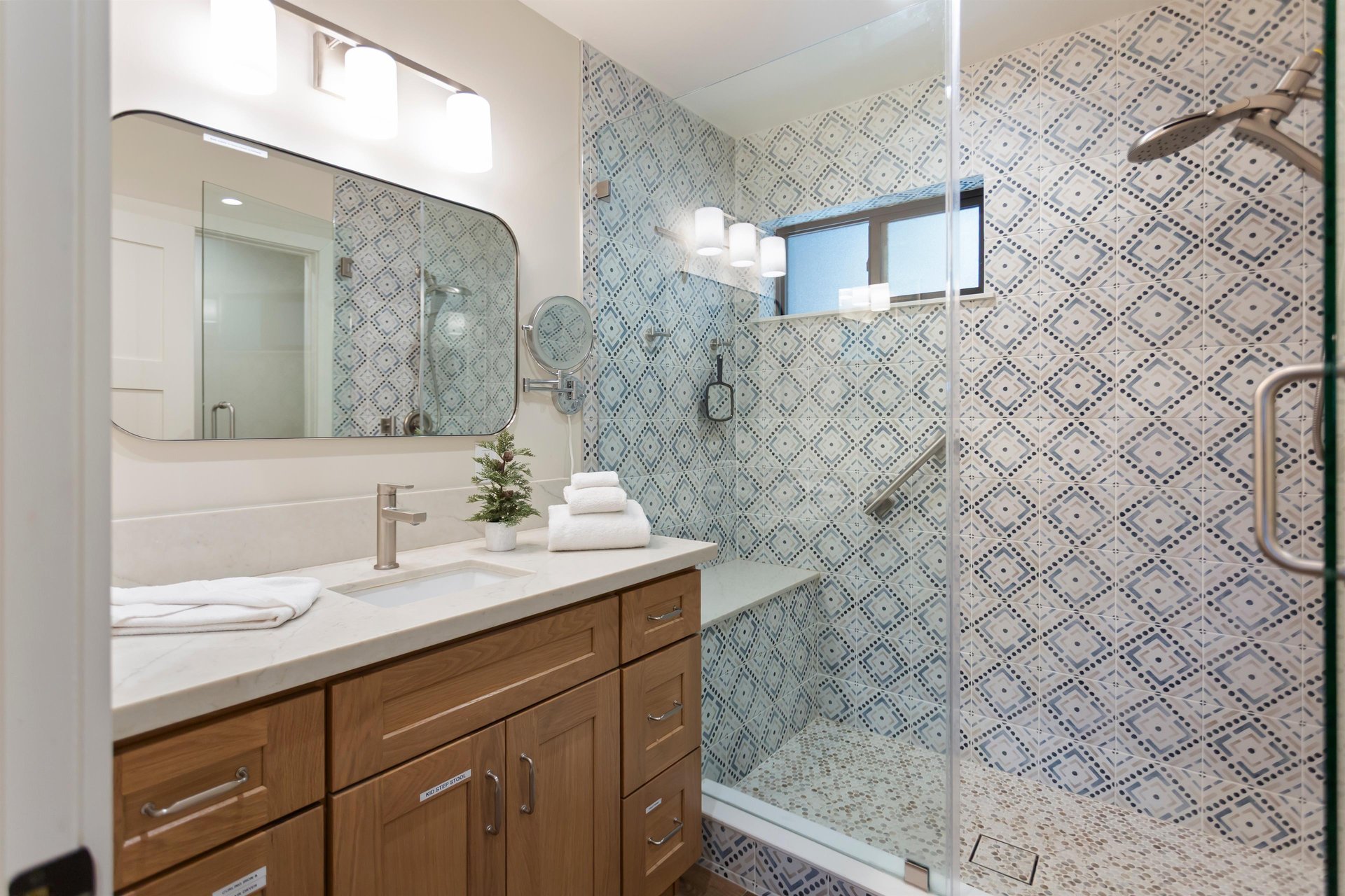 Upstairs with a step in shower and shower seat.