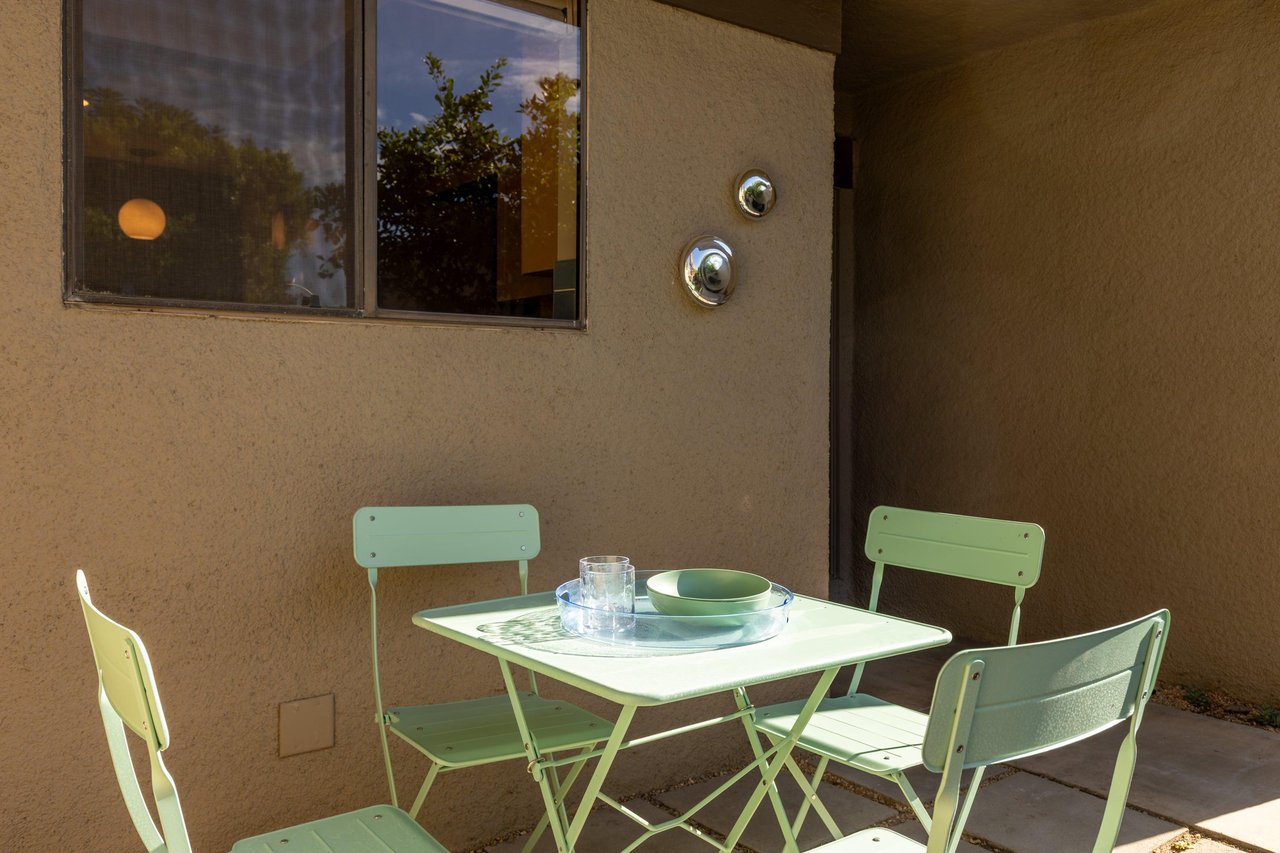 Front patio has additional table and chairs, BBQ, and access to the patio connected to the guest bedroom.