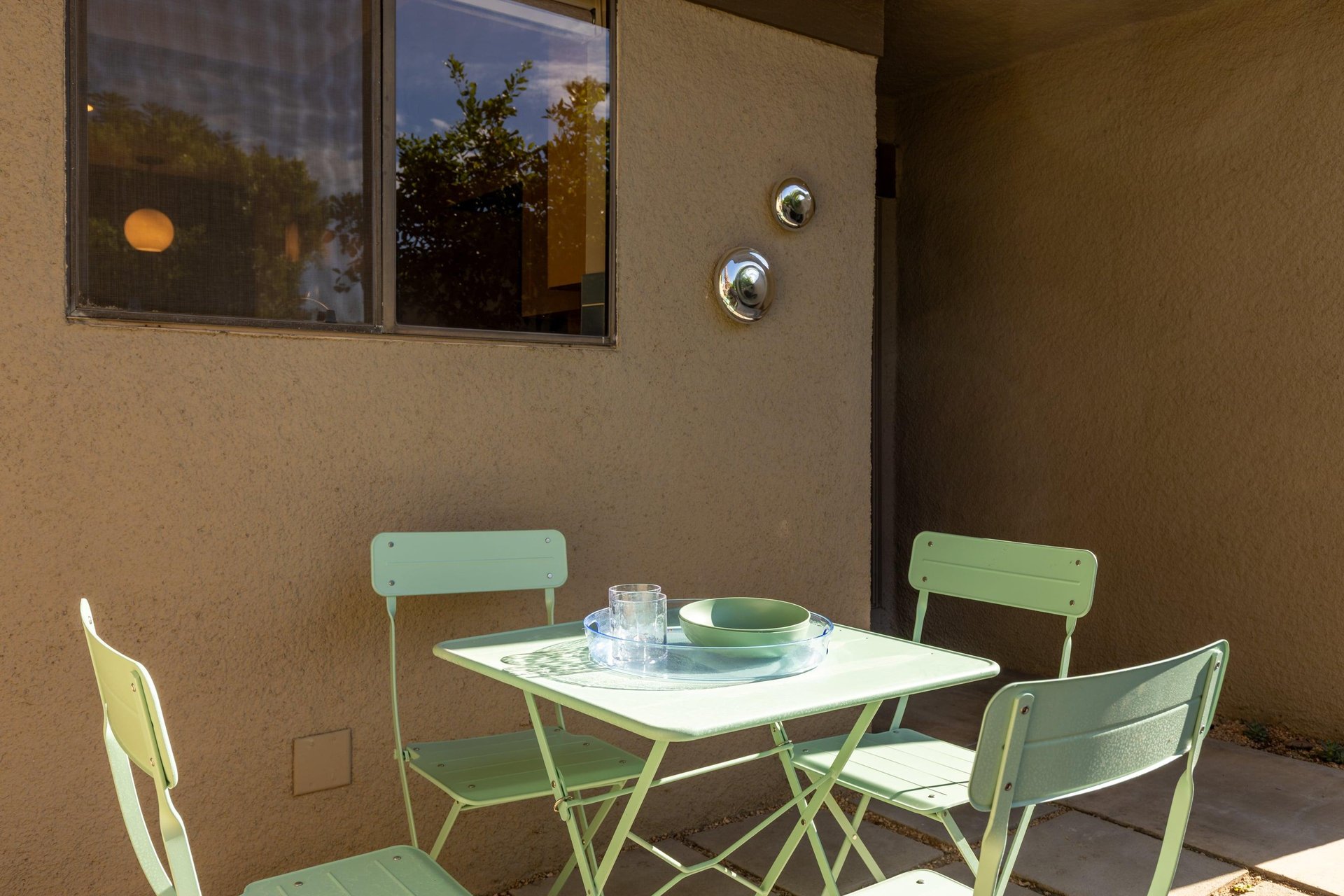 Front patio has additional table and chairs, BBQ, and access to the patio connected to the guest bedroom.