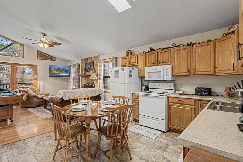 Your openconcept retreat blends kitchen, dining and living spaces seamlessly, creating the perfect gathering spot for memorable meals together.