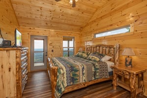 King Bed with window and door to deck