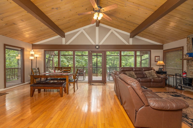 Deck entry into dining and living room seating at Buena Vista Getaway, 3 bedroom cabin rental located in Gatlinburg