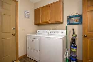 Laundry room in entry level bath