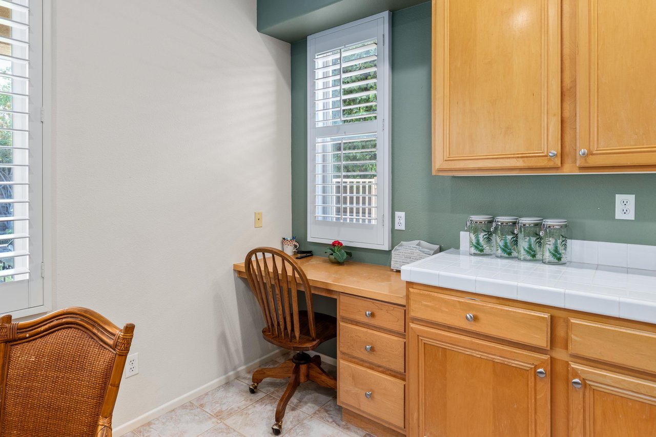 Desk space located near kitchen area.