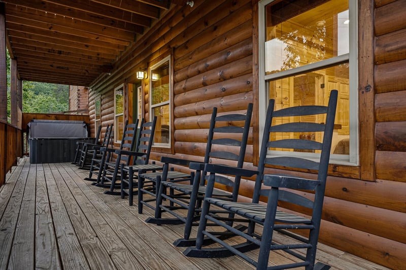Picture yourself unwinding in your own rocking chair on this spacious covered porch, soaking in mountain air while a private hot tub awaits just steps away.
