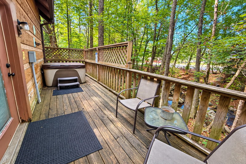 Step onto your private deck surrounded by leafy woodland—perfect for morning coffee or an evening soak in the hot tub.