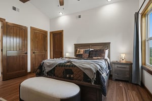 Slip into your cozy retreat with rustic charm and modern comfort. Warm wood details and vaulted ceilings create a peaceful space for restful nights.