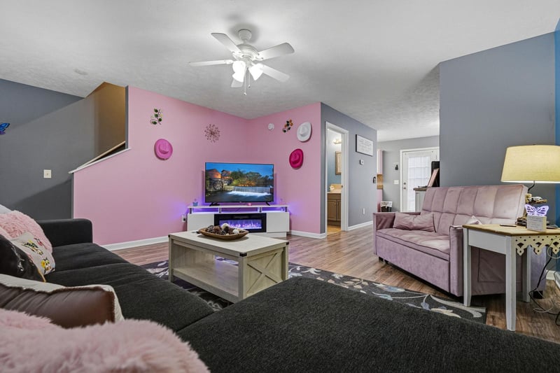 Unwind in your spacious living area with plush seating, ambient LED lighting, and a cozy electric fireplace to set the perfect mood for relaxing evenings.