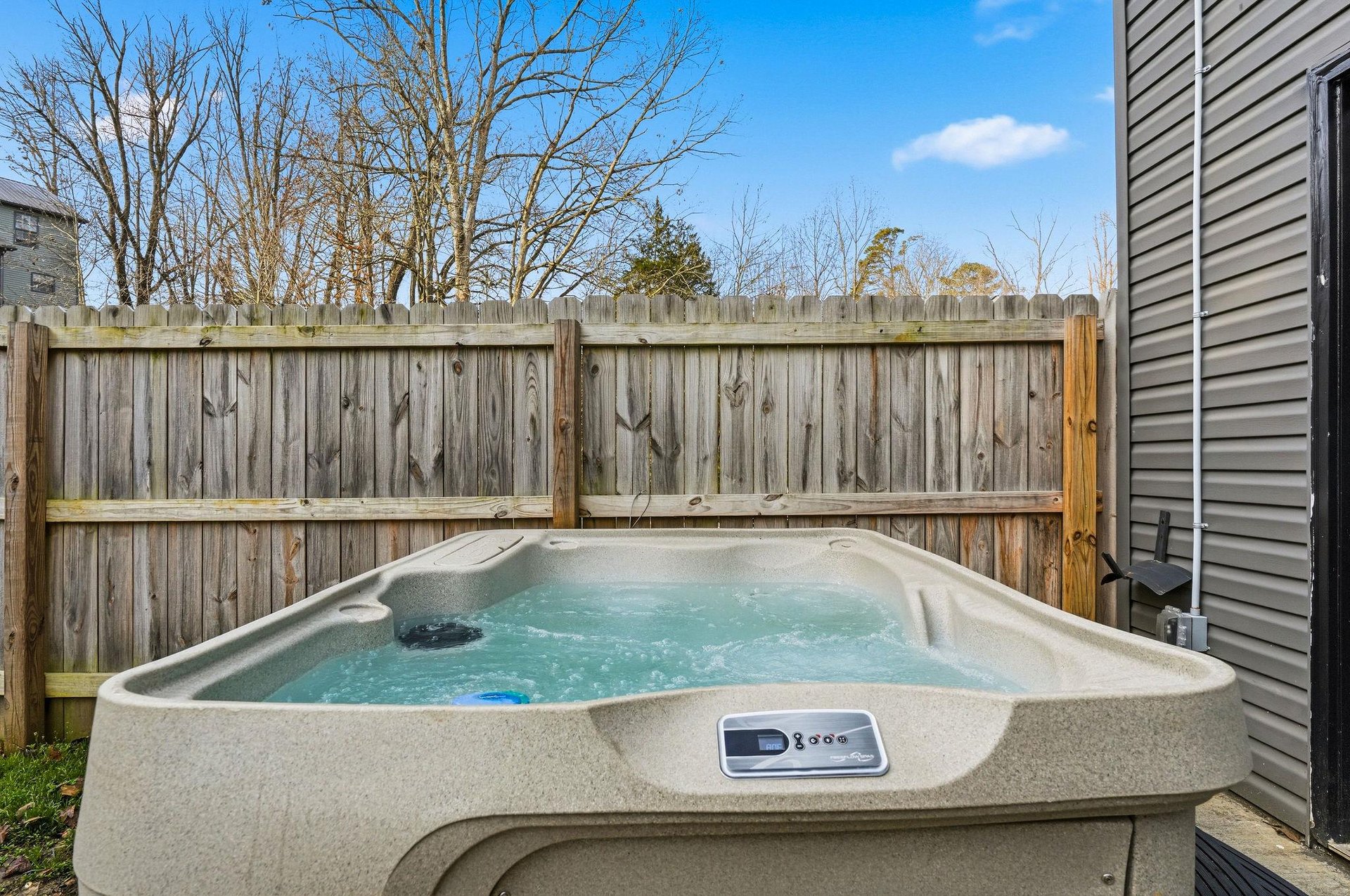 Soak away your stress in your private hot tub, surrounded by a peaceful fenced yard under open skies.