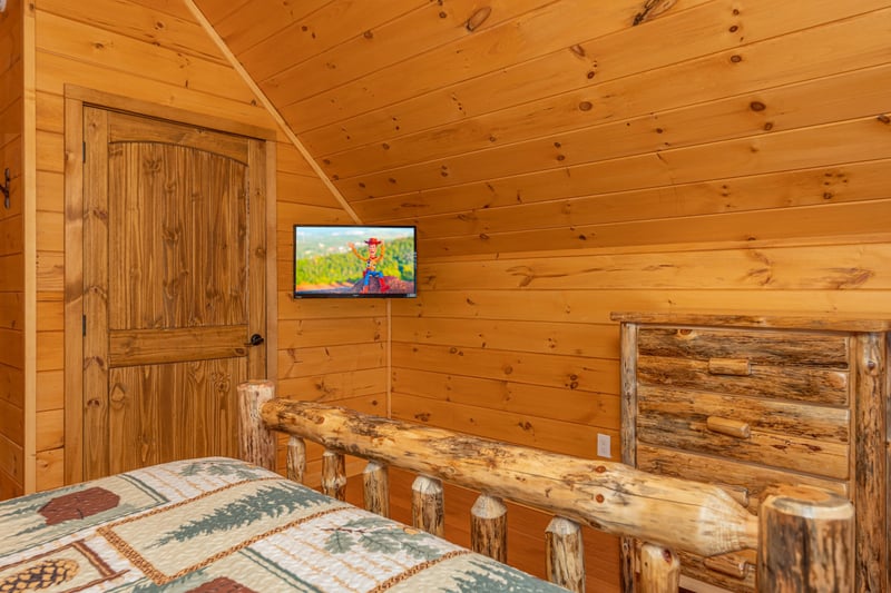 TV and dresser in the loft bedroom at Js Hideaway, a 4 bedroom cabin rental located in Pigeon Forge