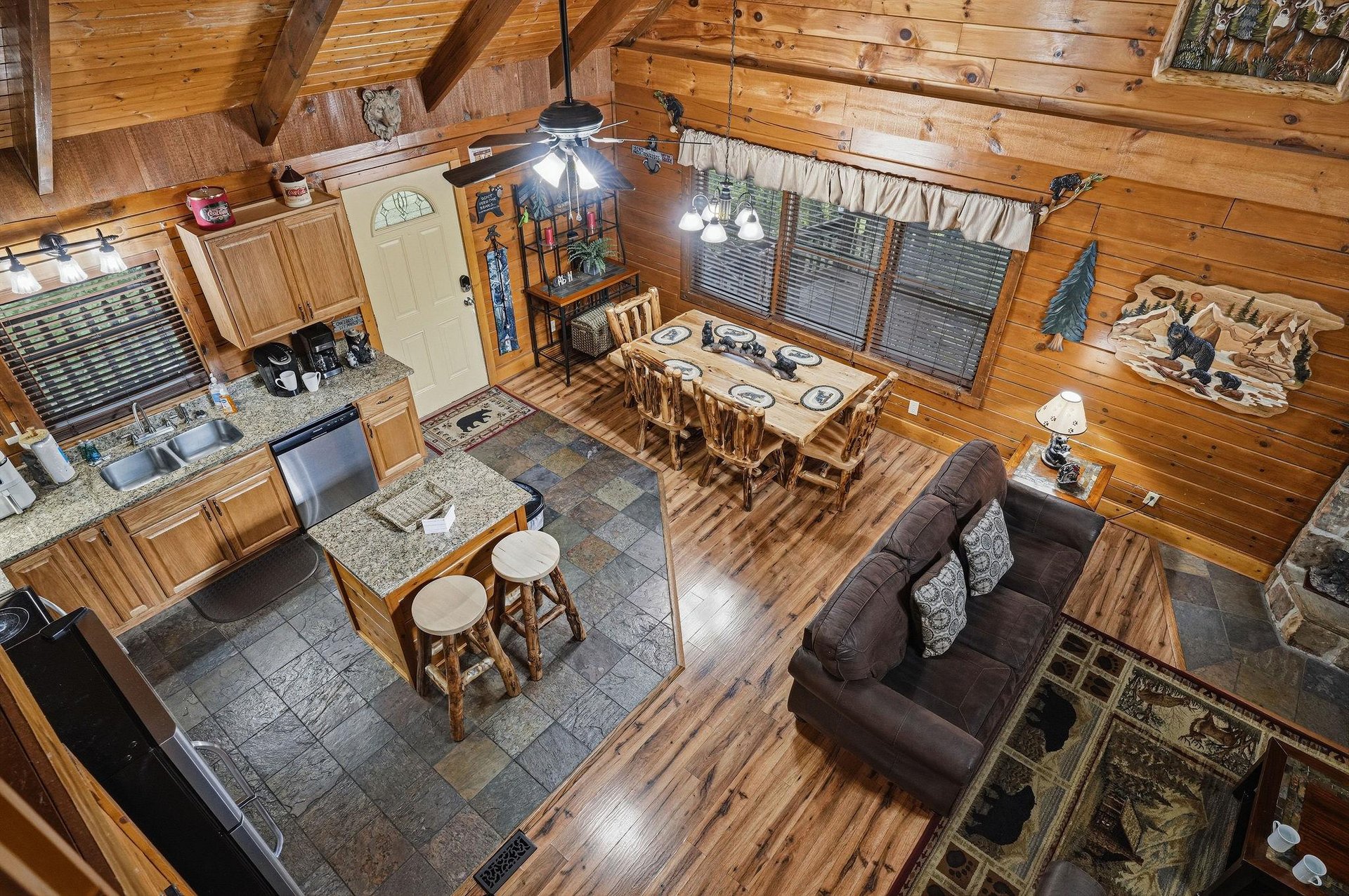This cozy cabin invites you to gather, unwind, and feel at home. Warm wood surrounds you while the open layout connects kitchen, dining, and living spaces—perfect for shared meals and lazy evenings to