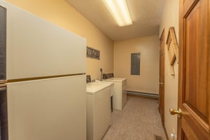 Laundry room with a fridge, washer, and dryer at Cubs Crib, a 3 bedroom cabin rental located in Gatlinburg