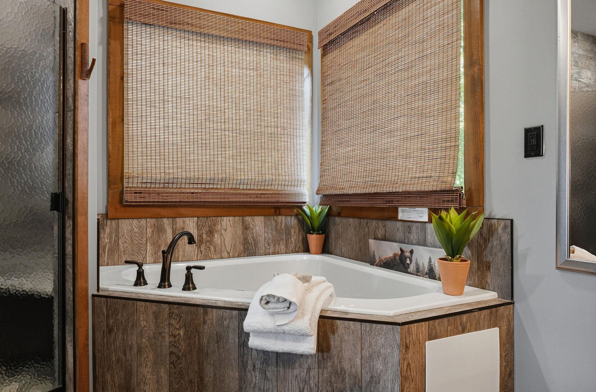 Sink into the deep soaking tub surrounded by warm wood and natural light—your private retreat for unwinding after a day of adventure.