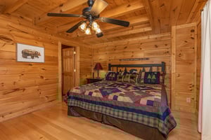 King bed, night stand, and lamp at Bears Dont Bluff, a 3 bedroom cabin rental located in Pigeon Forge