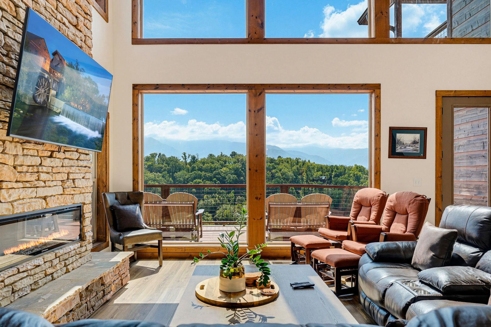 Settle into your private retreat and take in sweeping mountain vistas through floortoceiling windows. Cozy up by the stone fireplace or step onto the deck to breathe in the fresh mountain air.