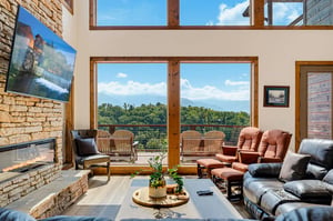 Settle into your private retreat and take in sweeping mountain vistas through floortoceiling windows. Cozy up by the stone fireplace or step onto the deck to breathe in the fresh mountain air.