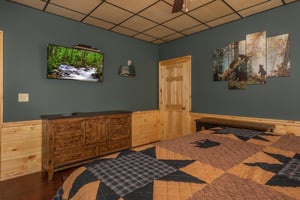 King bed facing dresser and tv