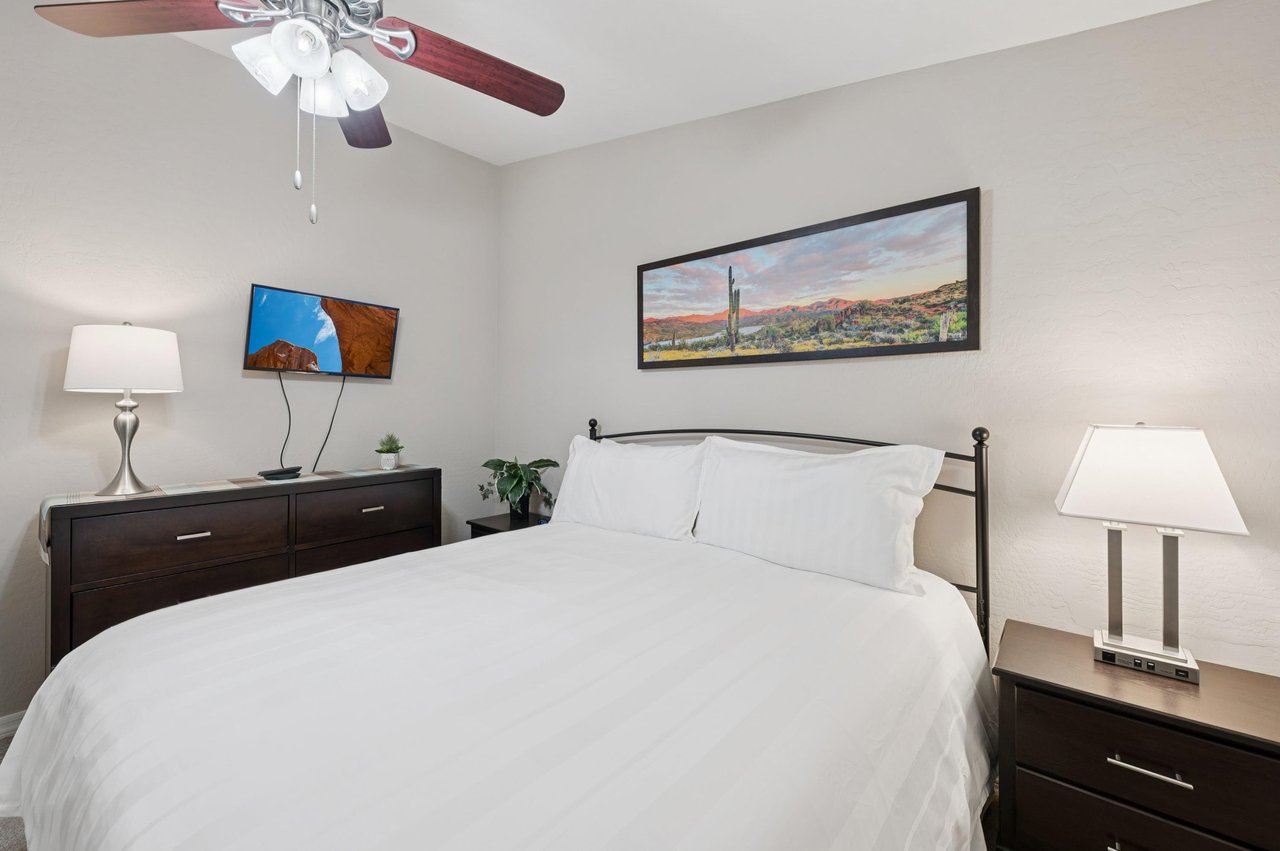 Comfy king bed with fresh linens, perfect for a restful nights sleep