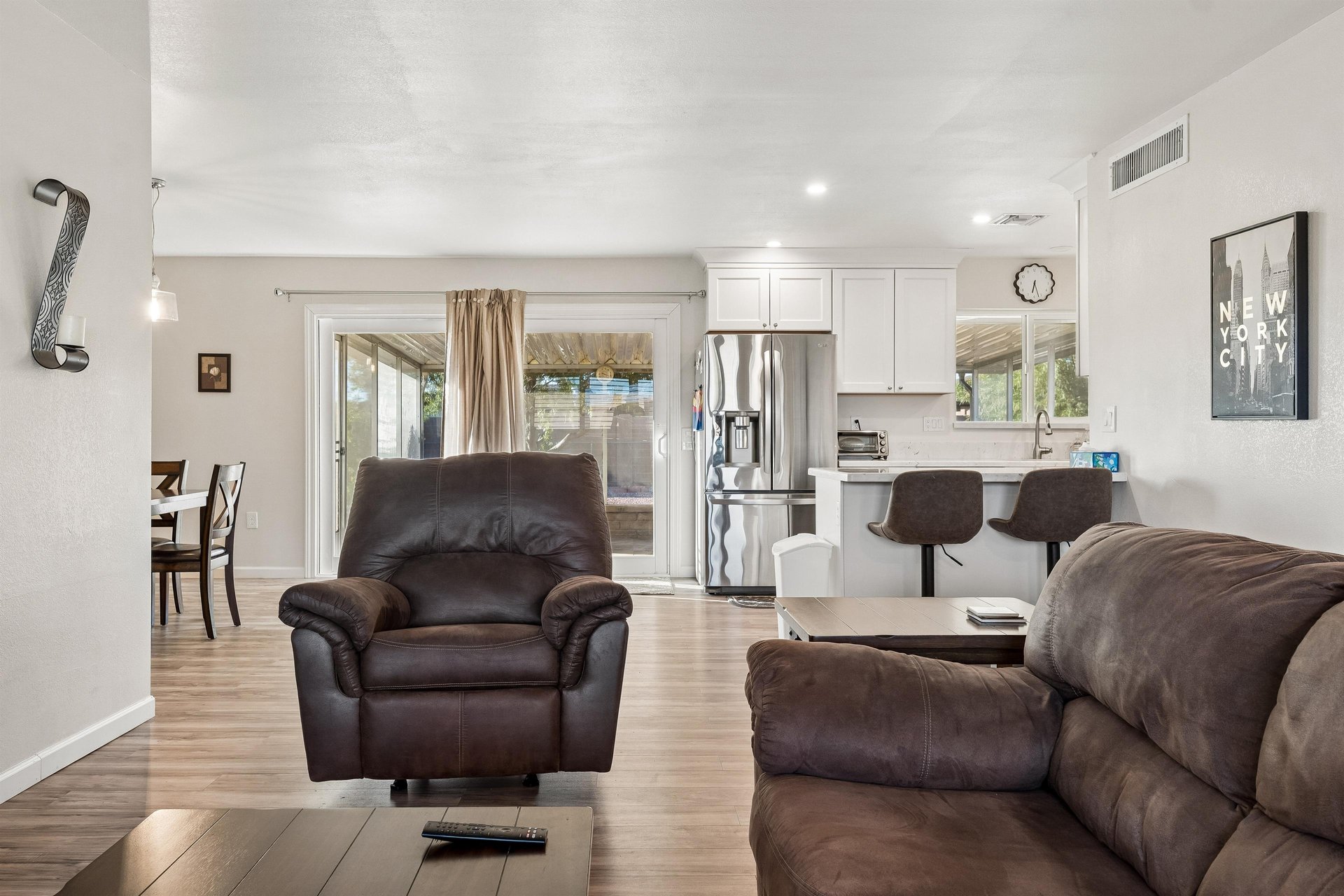 Features a flatscreen TV with streaming, pullout couch for additional sleeping space, and openconcept floor plan.