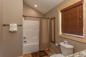 Bathtubshower with window over toilet