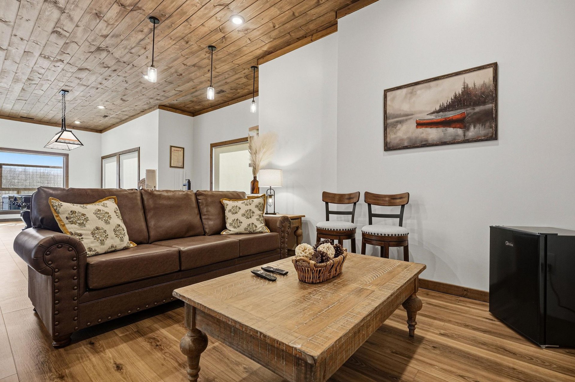Unwind in your rusticchic living space with rich leather seating, warm wood ceiling, and thoughtful touches that create the perfect mountain retreat atmosphere.