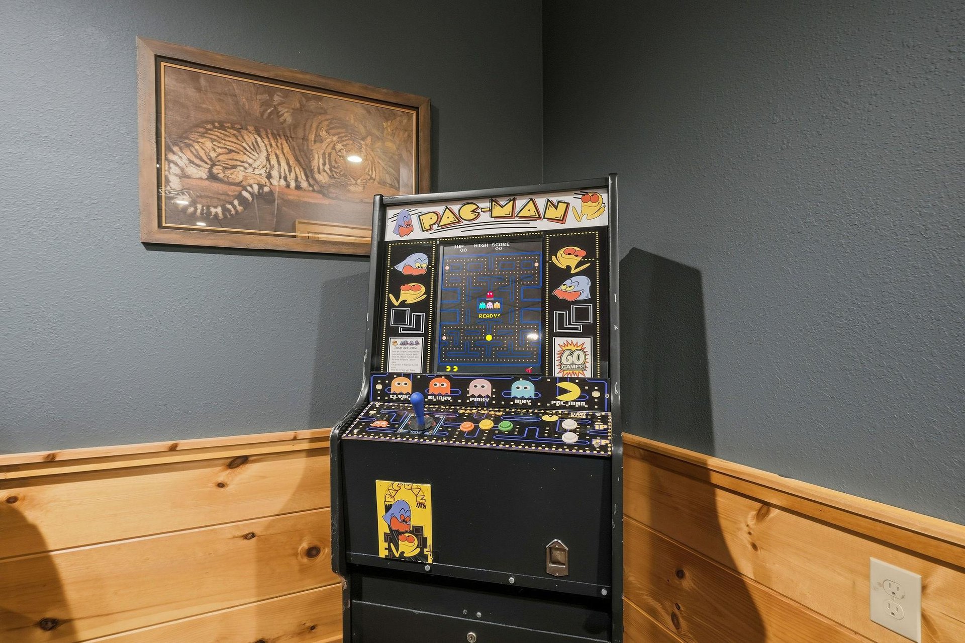 Challenge yourself to a classic PacMan game in your cozy corner retreat, where vintage arcade fun meets modern comfort.