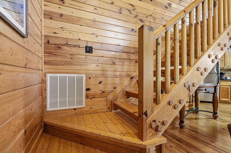 Warm wood surrounds you in this cozy cabin interior, where rustic charm meets comfort with handcrafted details throughout.