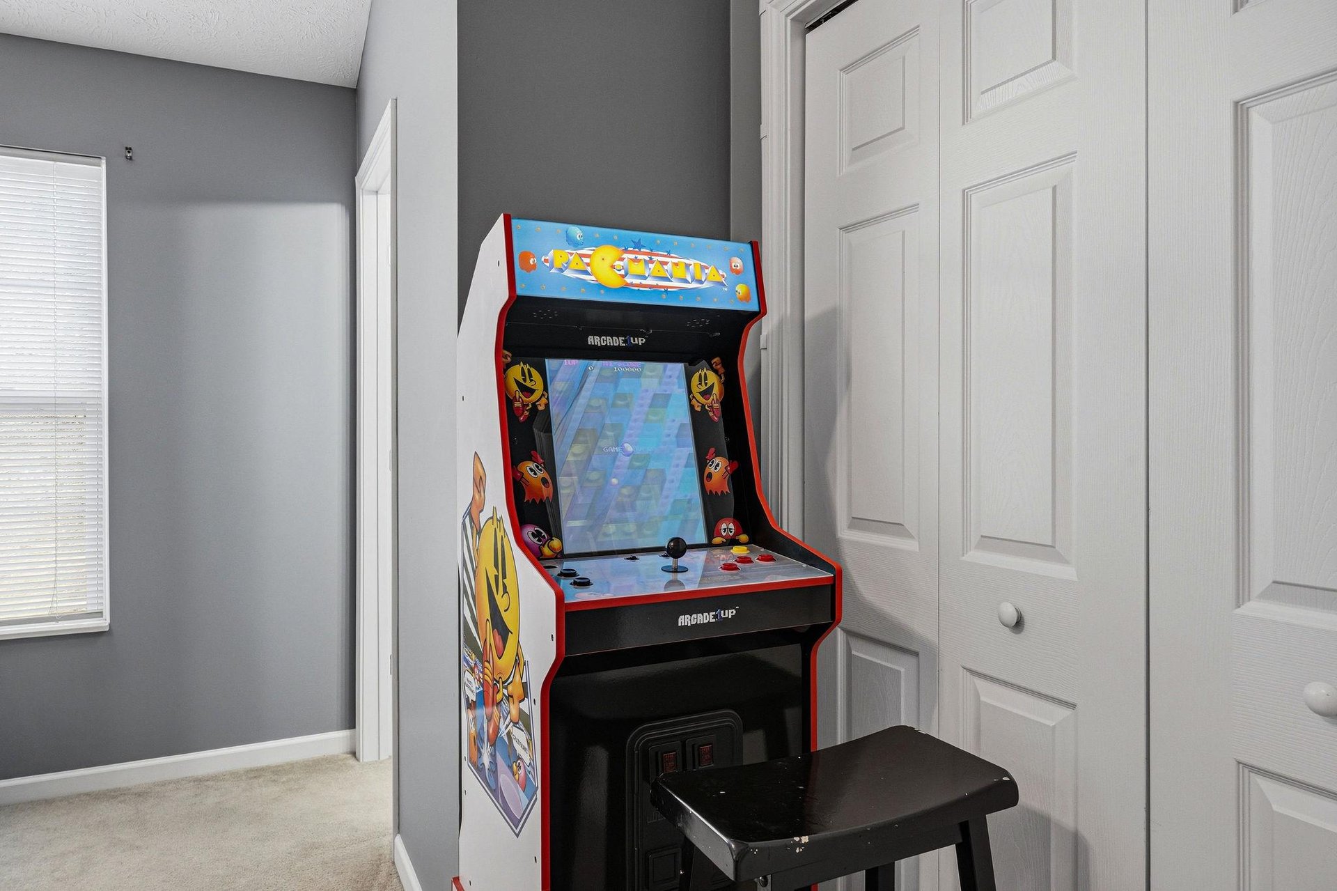 Challenge friends to your favorite retro games on this classic arcade machine in your cozy entertainment nook.