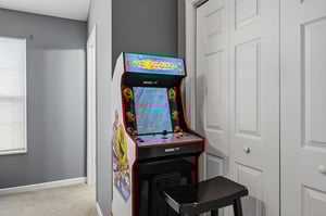Challenge friends to your favorite retro games on this classic arcade machine in your cozy entertainment nook.