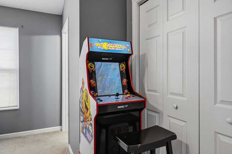 Challenge friends to your favorite retro games on this classic arcade machine in your cozy entertainment nook.
