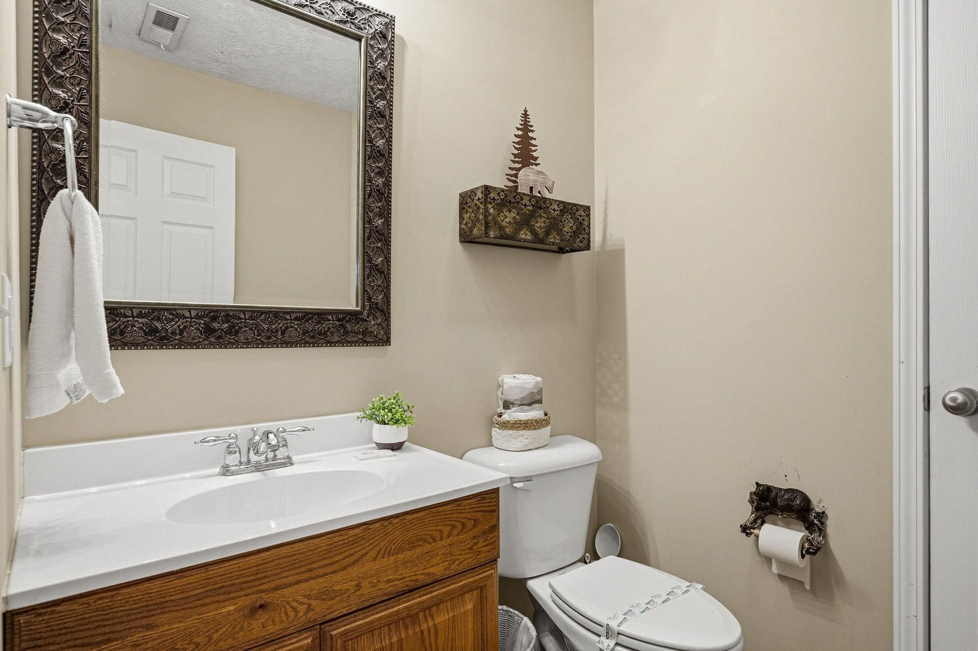 Freshen up in your private bathroom featuring elegant decor, thoughtful amenities, and charming touches that make it feel like home.