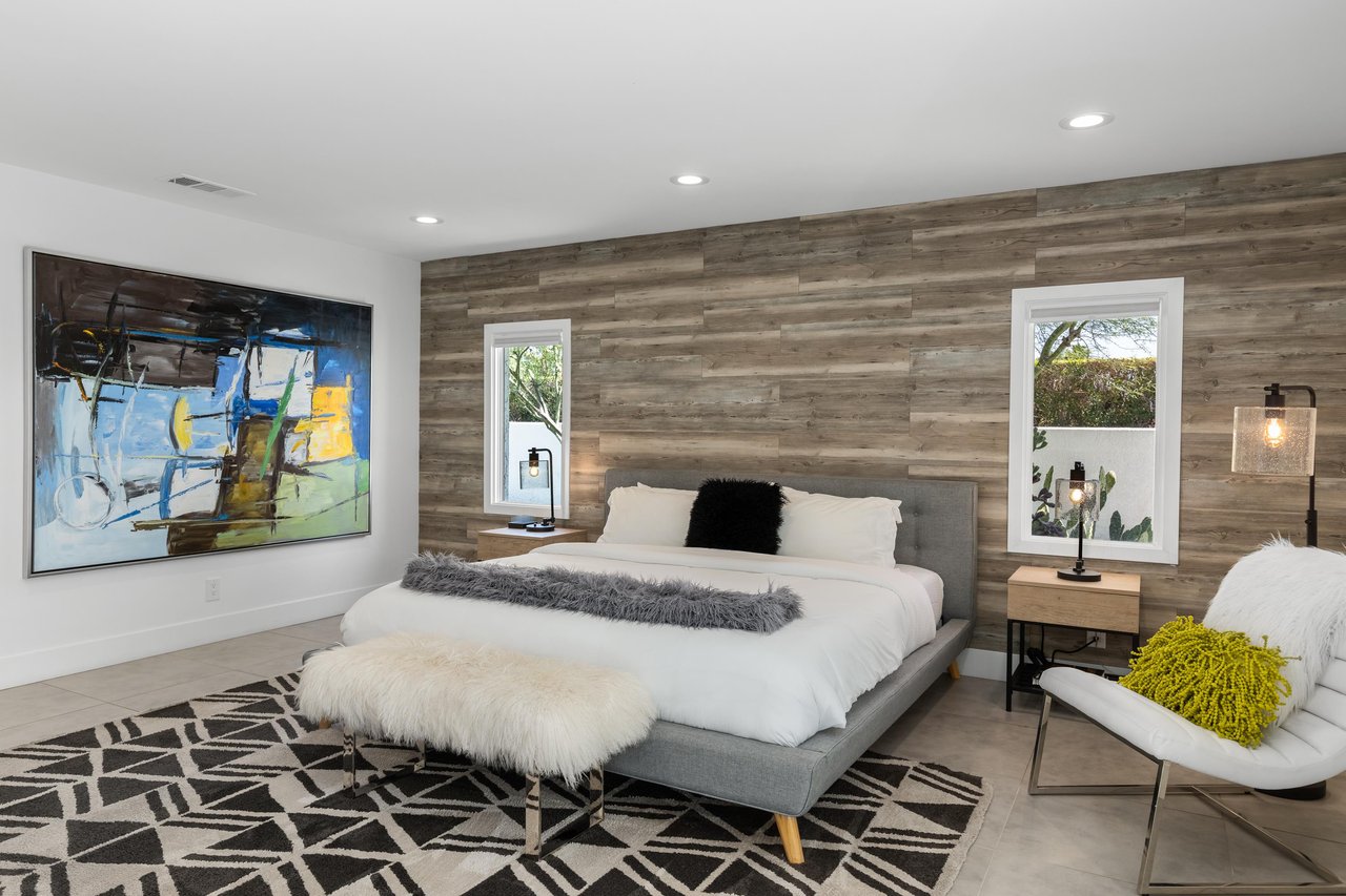 King size bed, seating area, private wet bar, bar seating, and direct patio access.