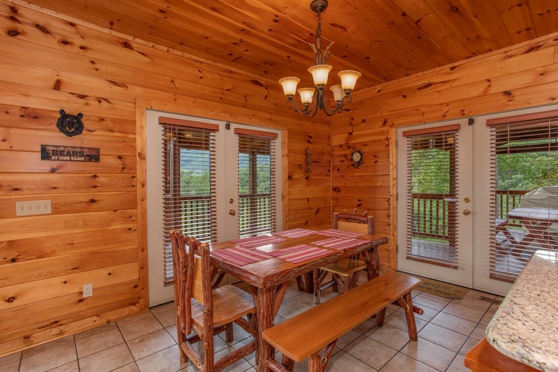 Dining space with seating for six at Four Seasons Lodge, a 3bedroom cabin rental located in Pigeon Forge