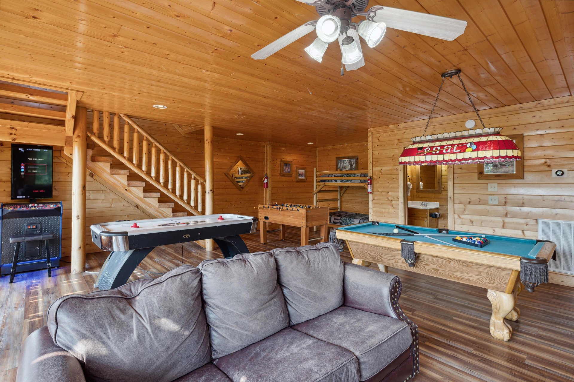 sofa, pool table, foosball and hocky table