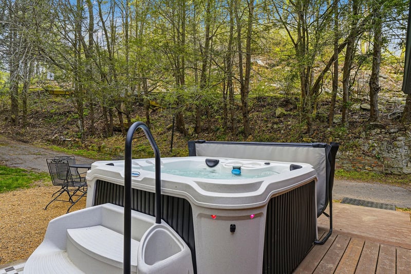 Soak away your stress in this private hot tub, surrounded by peaceful woodland views for ultimate relaxation.