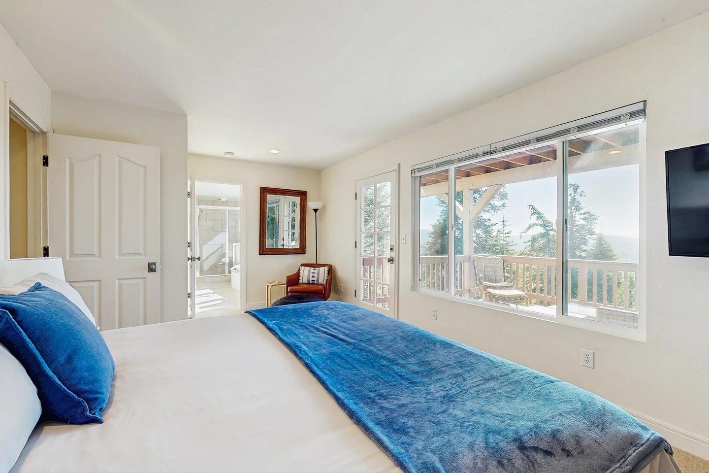 King size bed, smart TV, fireplace, private deck access, and ensuite bathroom.
