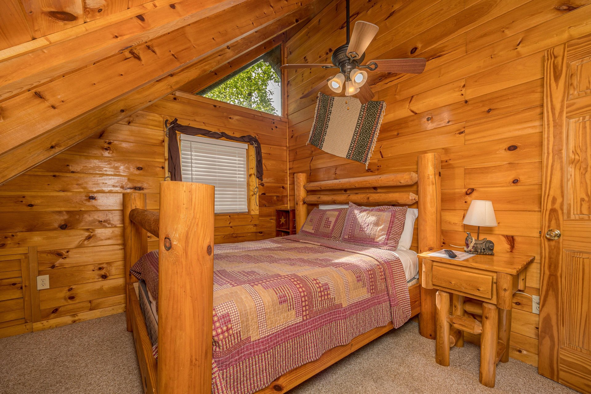 Queen bed with sloped wall