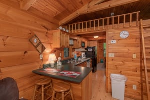 barstool seating for two and kitchen at angels dream a 1 bedroom cabin rental located in gatlinburg
