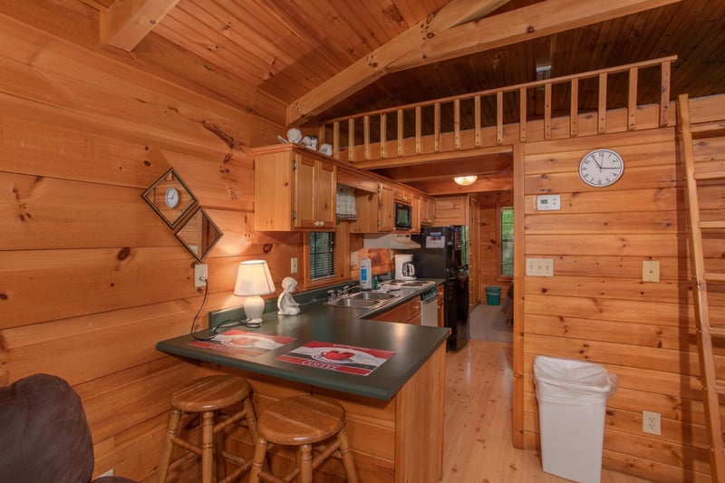 barstool seating for two and kitchen at angels dream a 1 bedroom cabin rental located in gatlinburg