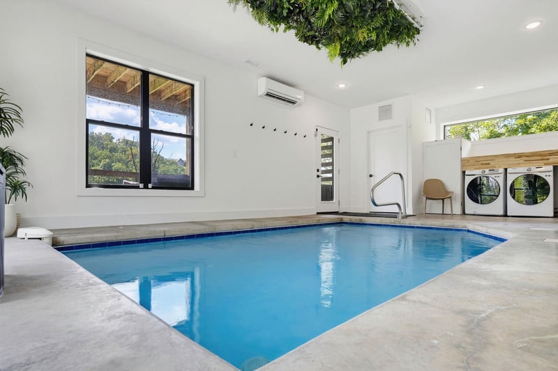 Your own private indoor pool awaits, complete with climate control and natural light streaming through bright windows. Refreshing dips any time of day in this serene, modern space.