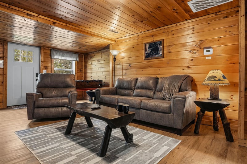 Sink into plush leather seating surrounded by warm wood walls that create your perfect mountain retreat atmosphere.