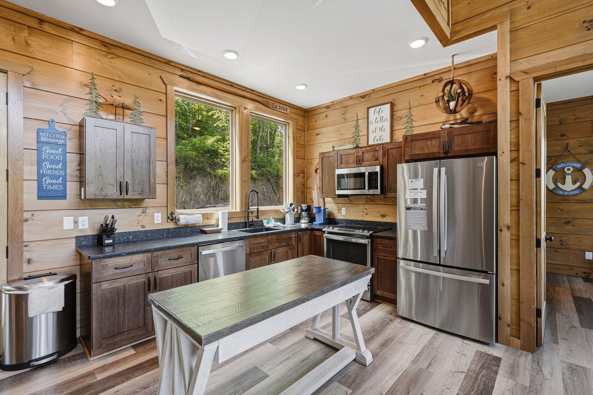 Cook memorable meals in your fully equipped rustic kitchen, featuring modern appliances and warm wood details for the perfect cabin experience.