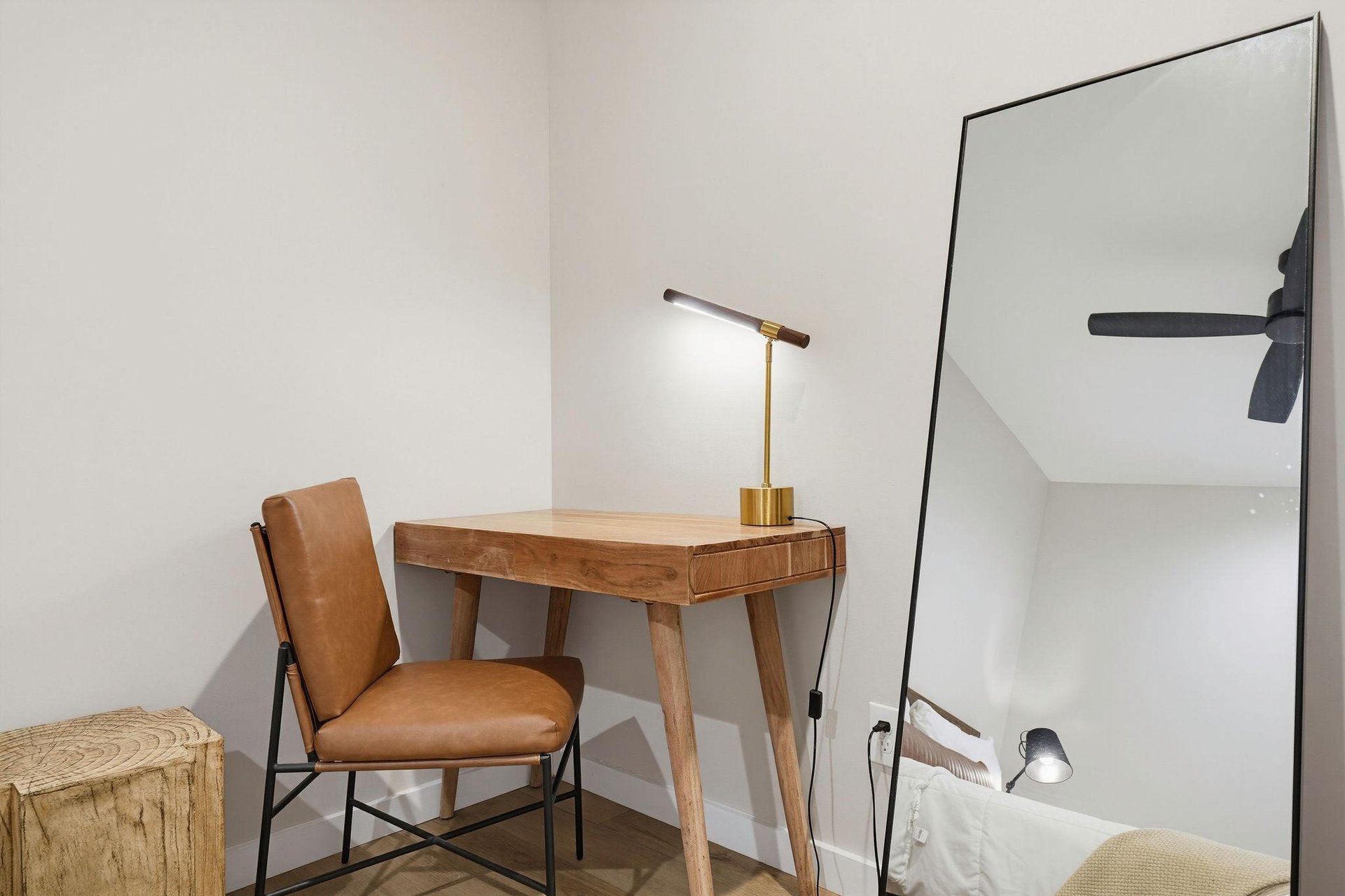 Find your focus at this stylish workspace, where warm wood tones and soft lighting create the perfect spot for catching up on emails or planning your next adventure.