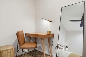 Find your focus at this stylish workspace, where warm wood tones and soft lighting create the perfect spot for catching up on emails or planning your next adventure.
